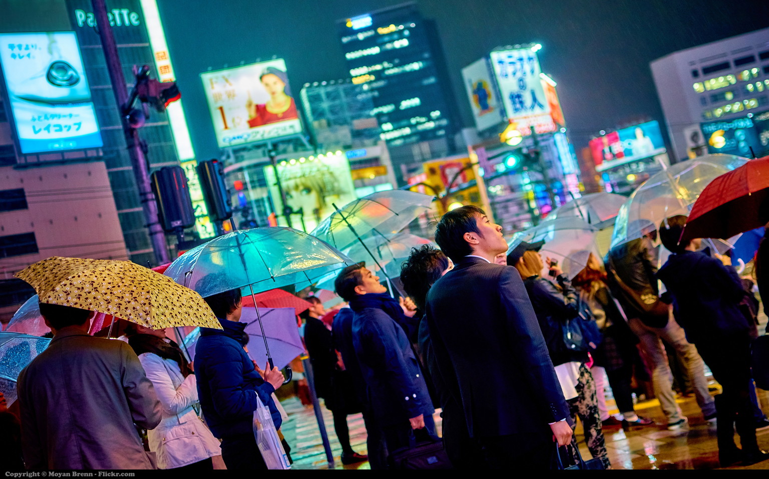 Shinjuku at night with neon streets and crowds